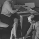 1966 caption: “A member of the International Society of Girl Watchers falls back on the old trick of ‘accidentally’ dropping his papers in order to get an eyeful.”